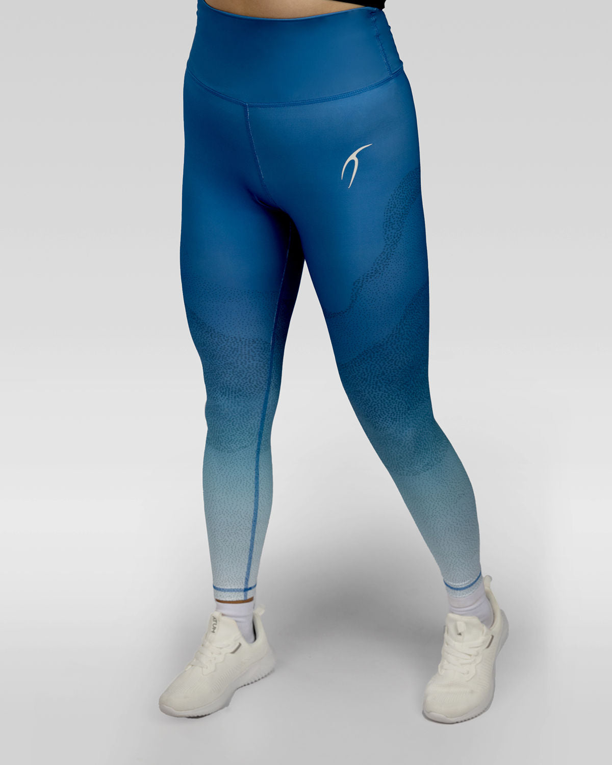 Photo by ð—”ð—§ð—¨ð— SPORTSWEAR ® on December 20, 2022. May be an image of 1 woman wears blue gradient leggings with white shoes.
