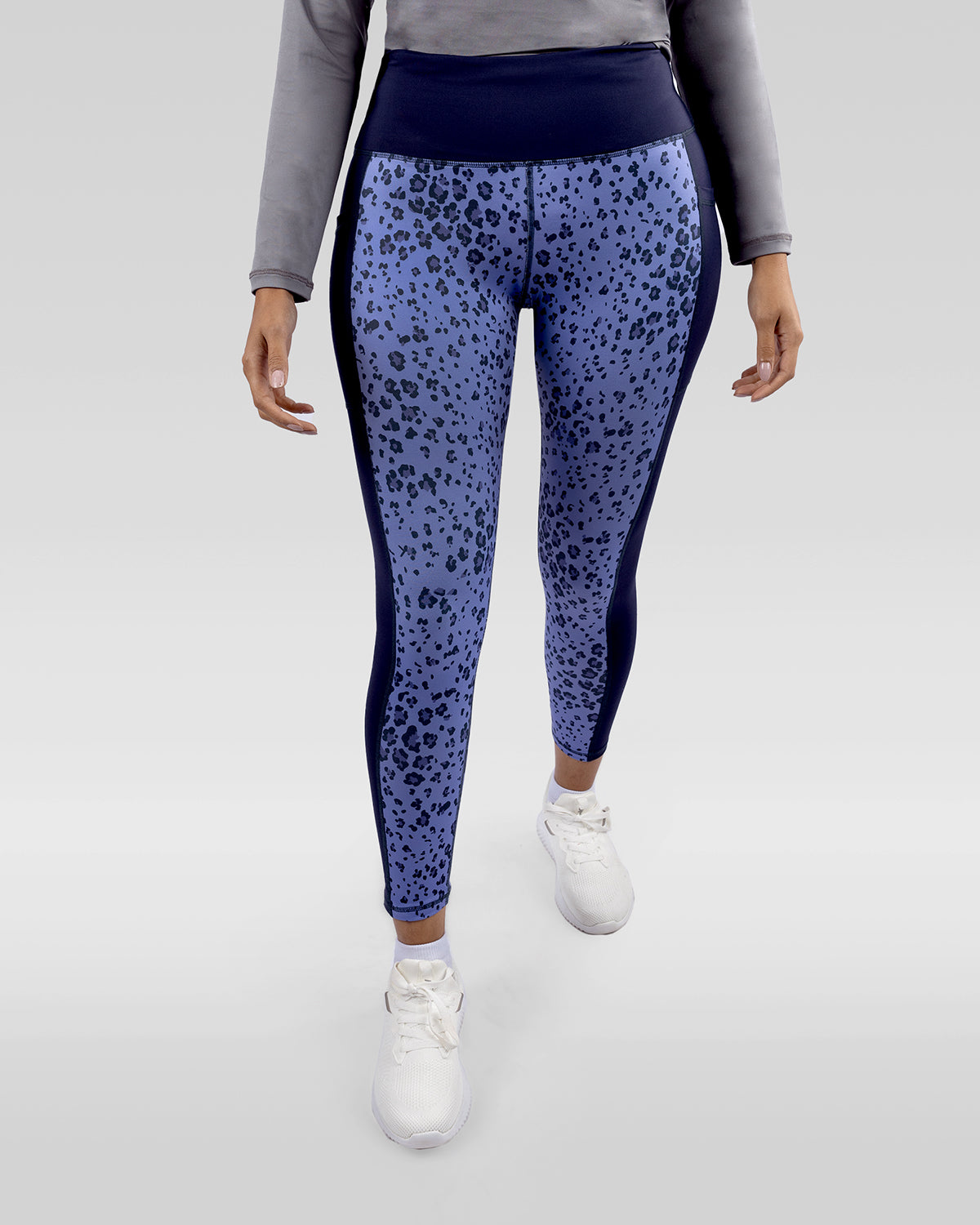 Photo by ð—”ð—§ð—¨ð— SPORTSWEAR Â® on December 20, 2022. May be an image of 1 woman wears printed purple/navy floral leggings, and white shoes.